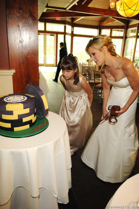 Laura looks at Peter’s special groom cake by: Kira Yustak
