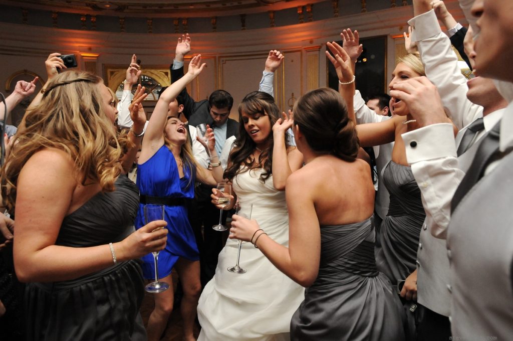 Bride Dancing with Friends by: Kira Yustak