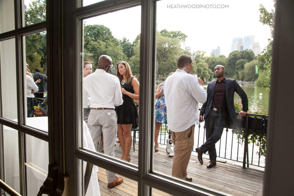 guests chilling out on the Boathouse deck overlooking The Lake by: Heathwood Photo