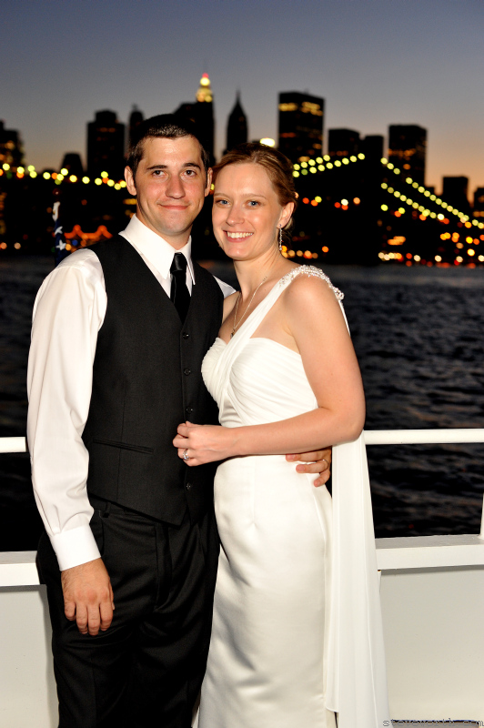 Heather and John – Nighttime cruise with skyline in back by: Steve Worth Photography