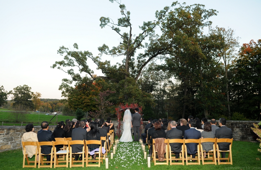 Carol and Jason – Outdoor Ceremony from the Back by: Kira Yustak