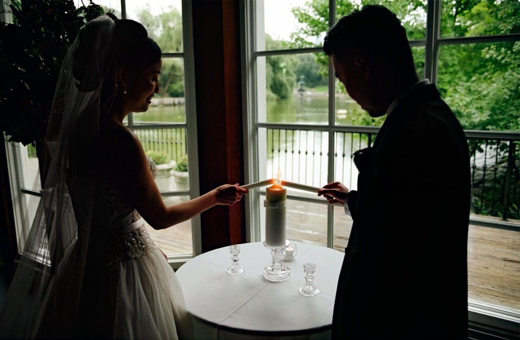 Lighting ceremony with Central Park Pond in background by: Robert London Photography