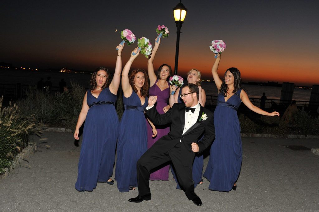 Groom with Bridesmaids after Sunset by: Steve Worth Photography