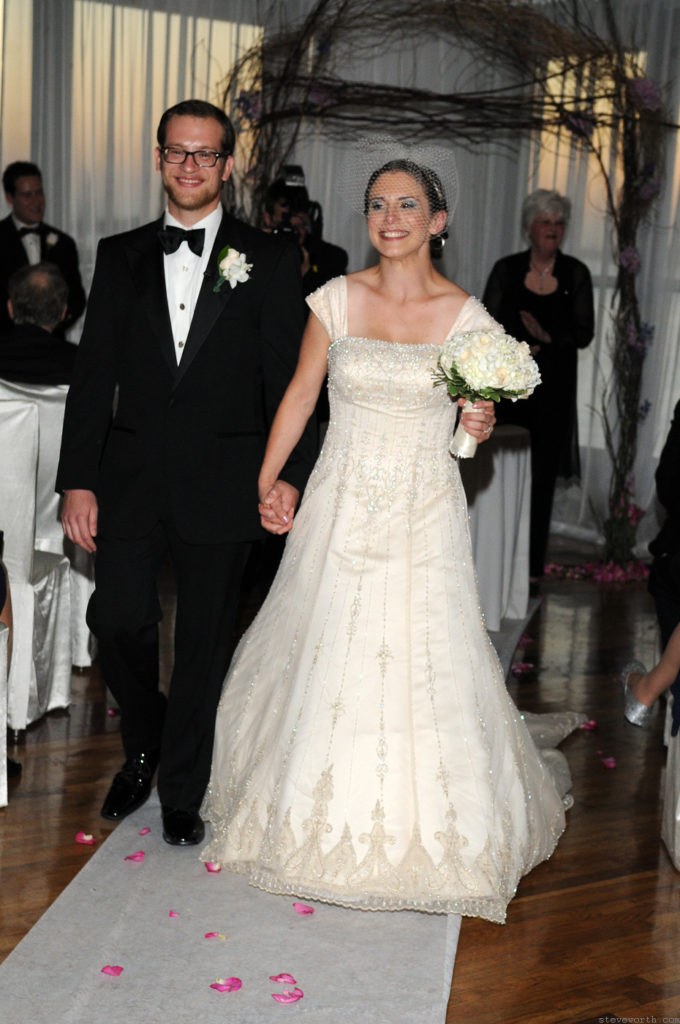 Rebecca and Ben walk up the Aisle by: Kira Yustak