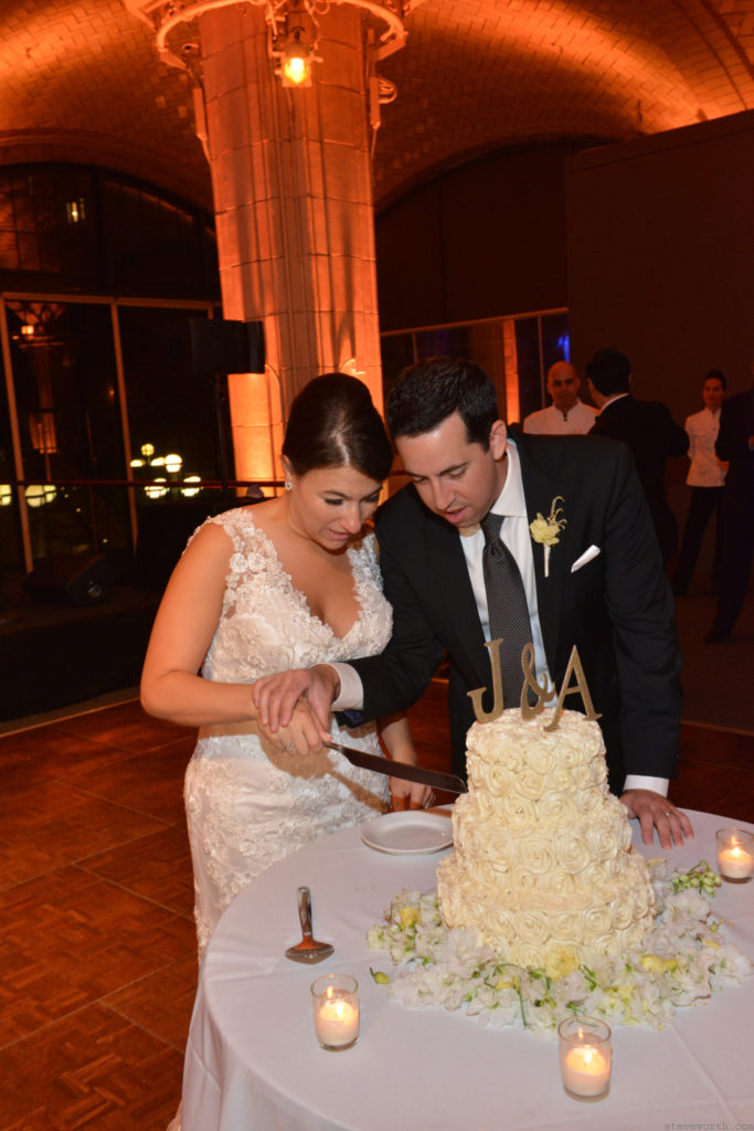 Anna and Joe cutting the cake by: Kira Yustak