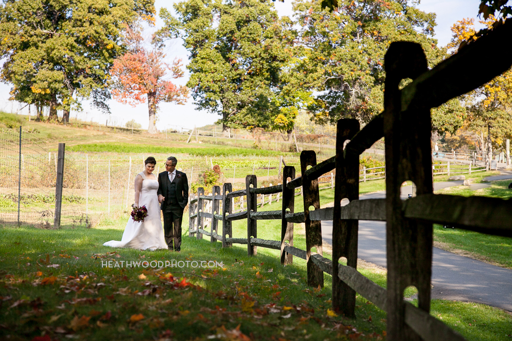 Bride and Groom in farm field by: Heathwood Photo