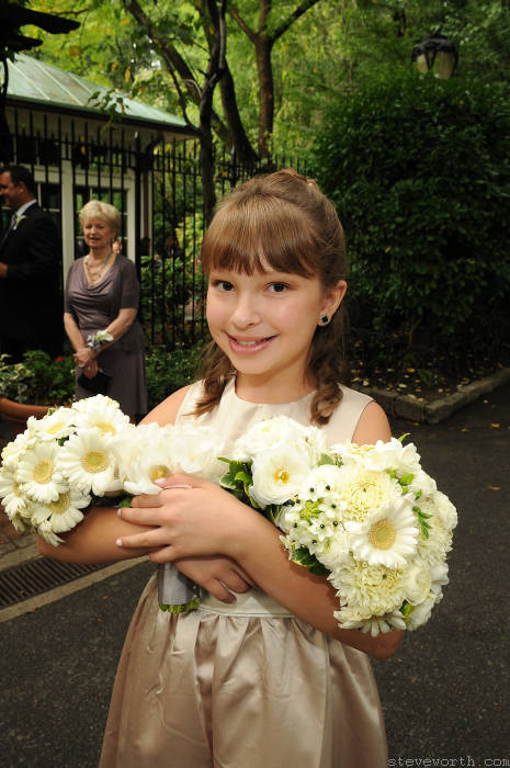 Bridesmaid holding 2 bouquets by: Kira Yustak