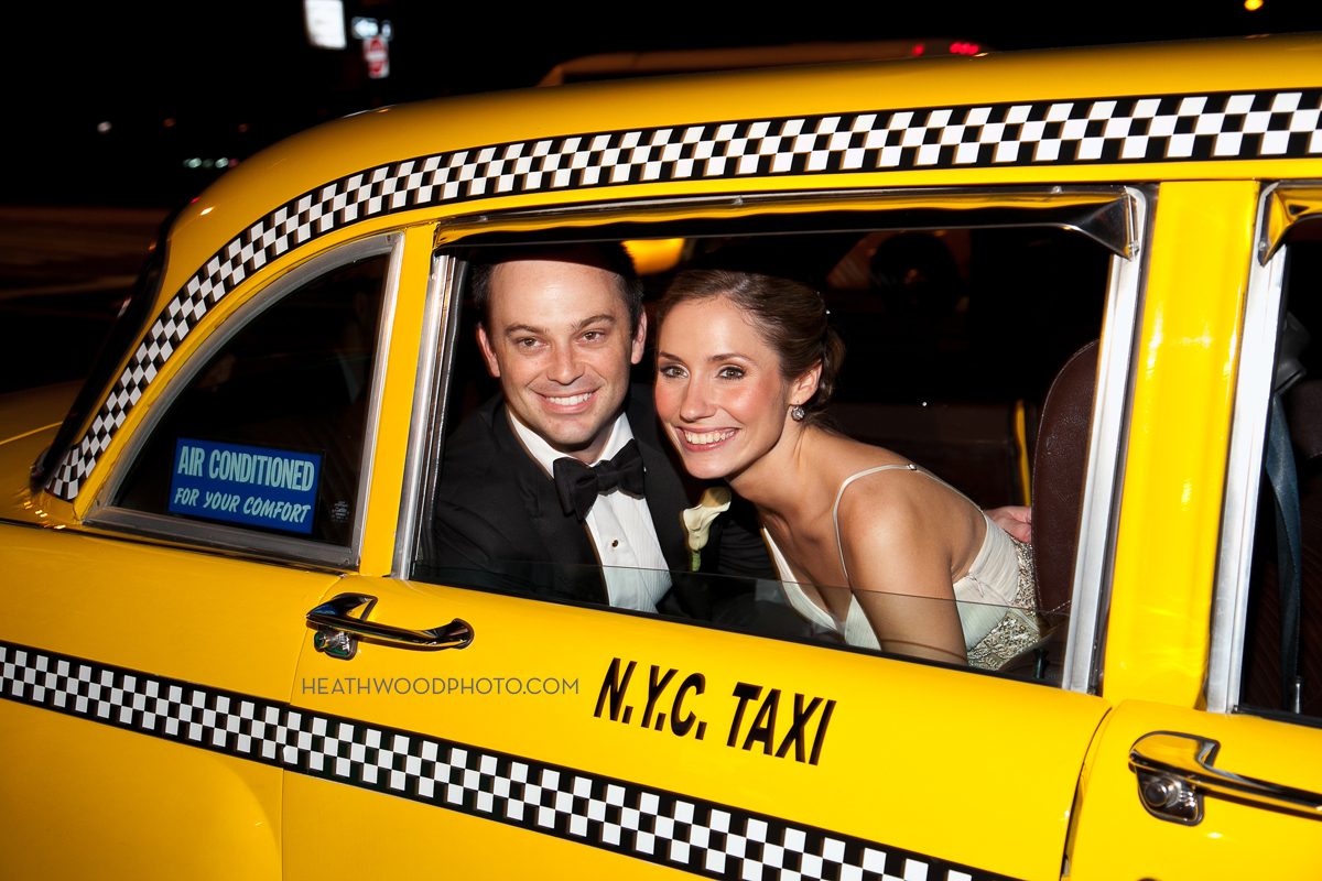 Bride and Groom leave for wedding night in vintage checker cab by: Heathwood Photo