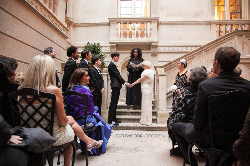 Wedding ceremony in open-air courtyard by: Heathwood Photo