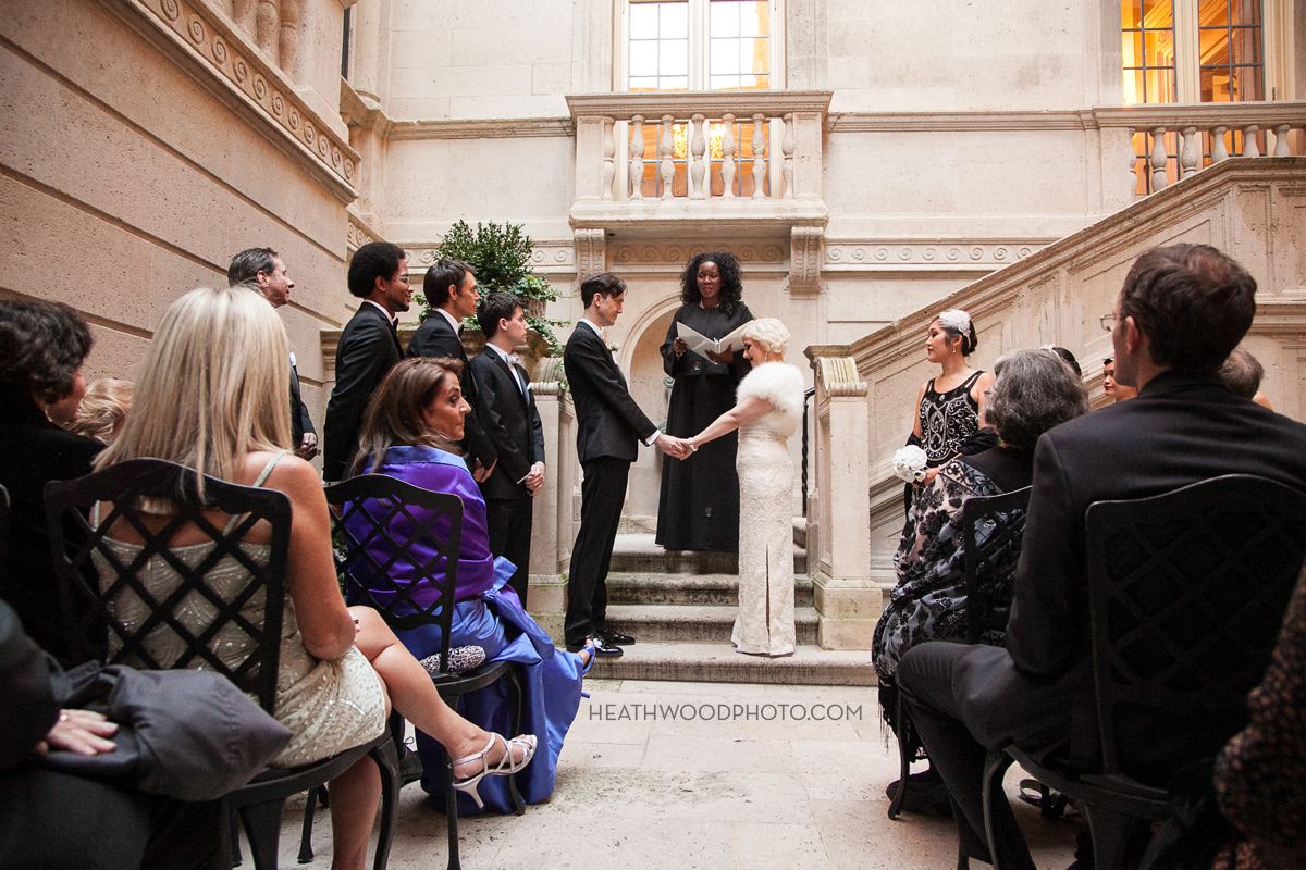 Wedding ceremony in open-air courtyard by: Heathwood Photo
