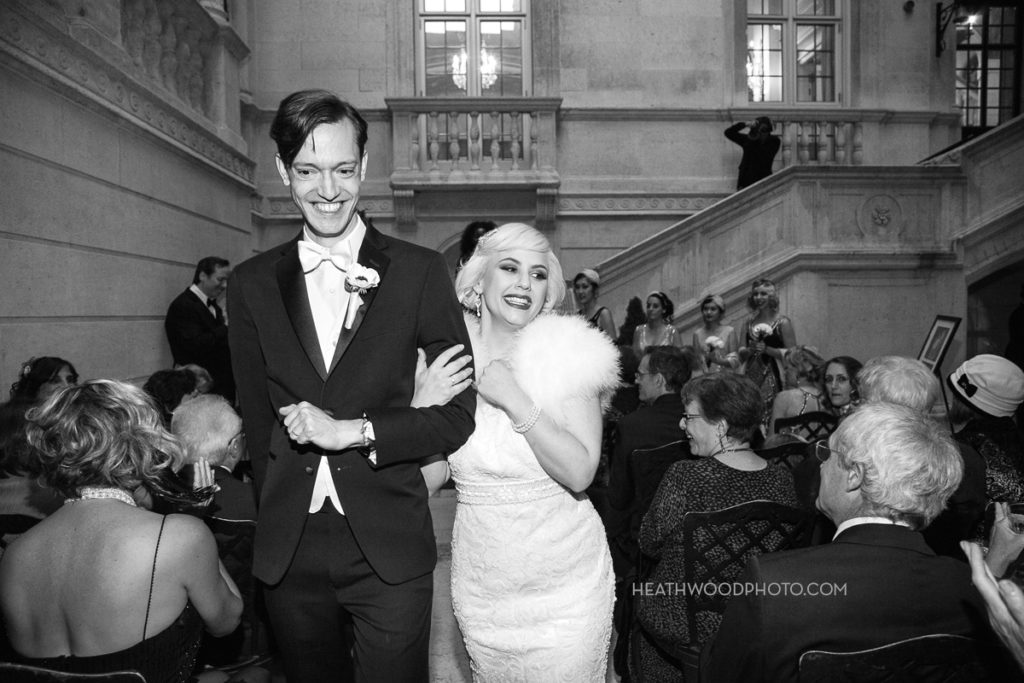 Groom and Bride walk away together after ceremony by: Heathwood Photo