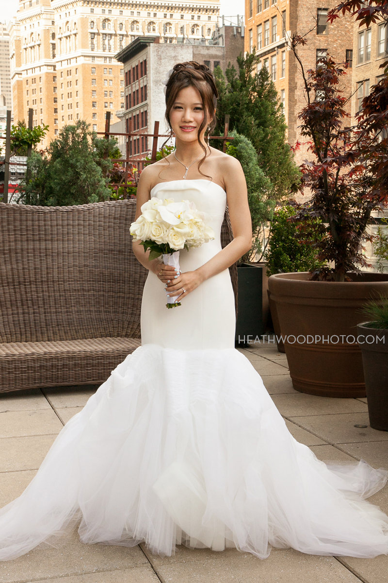 Bride on bridal room’s outdoor roof deck by: Heathwood Photo