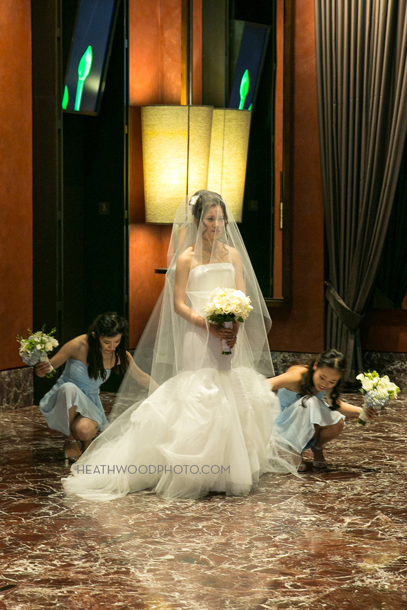 Bridesmaids help bride before she walks down the aisle by: Heathwood Photo