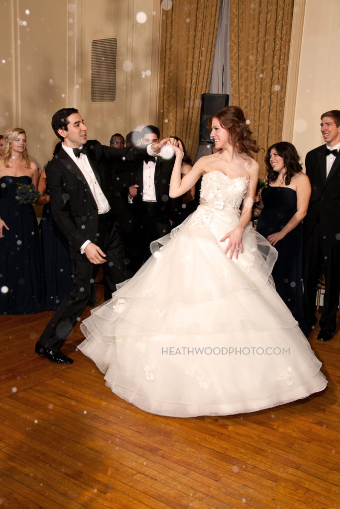 Bride and groom’s first dance with snow falling on dance floor! by: Heathwood Photo