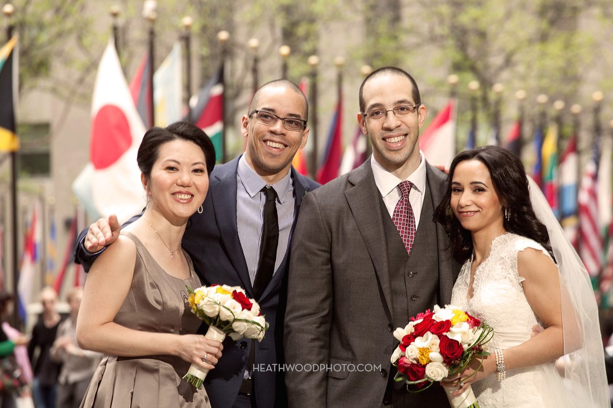 Bride, groom and attendants across the street in Rockefeller Plaza by: Heathwood Photo