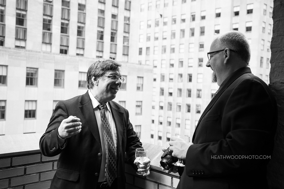 Guests on rooftop deck during cocktail reception by: Heathwood Photo