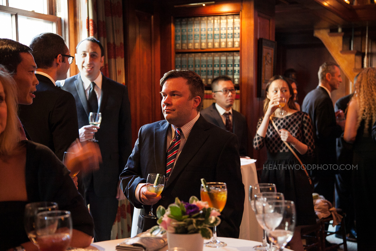 Cocktail reception in the library by: Heathwood Photo