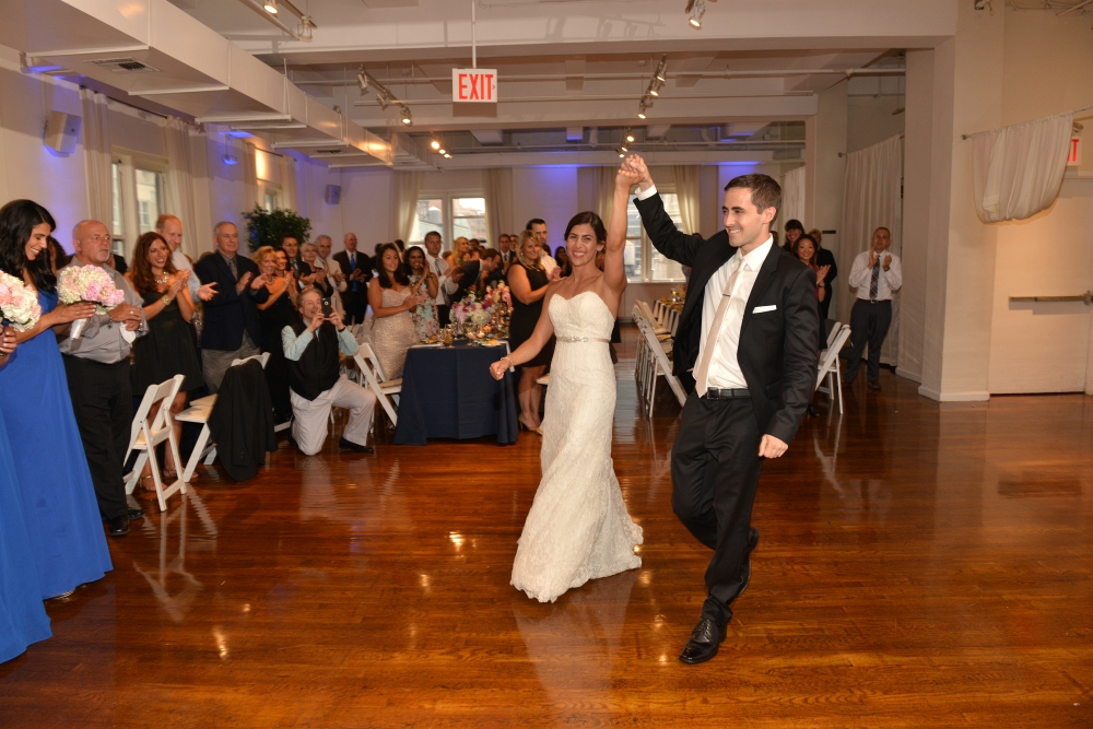 Bride and Groom Entering the Reception by: Steve Worth Photography