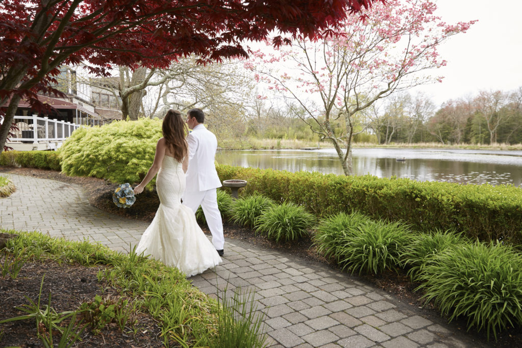 Bride and groom walking. by: Windsor Photo NYC