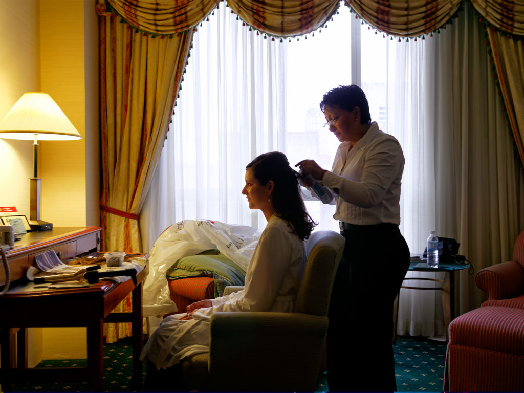 Finishing touches before the dress by: Robert London Photography